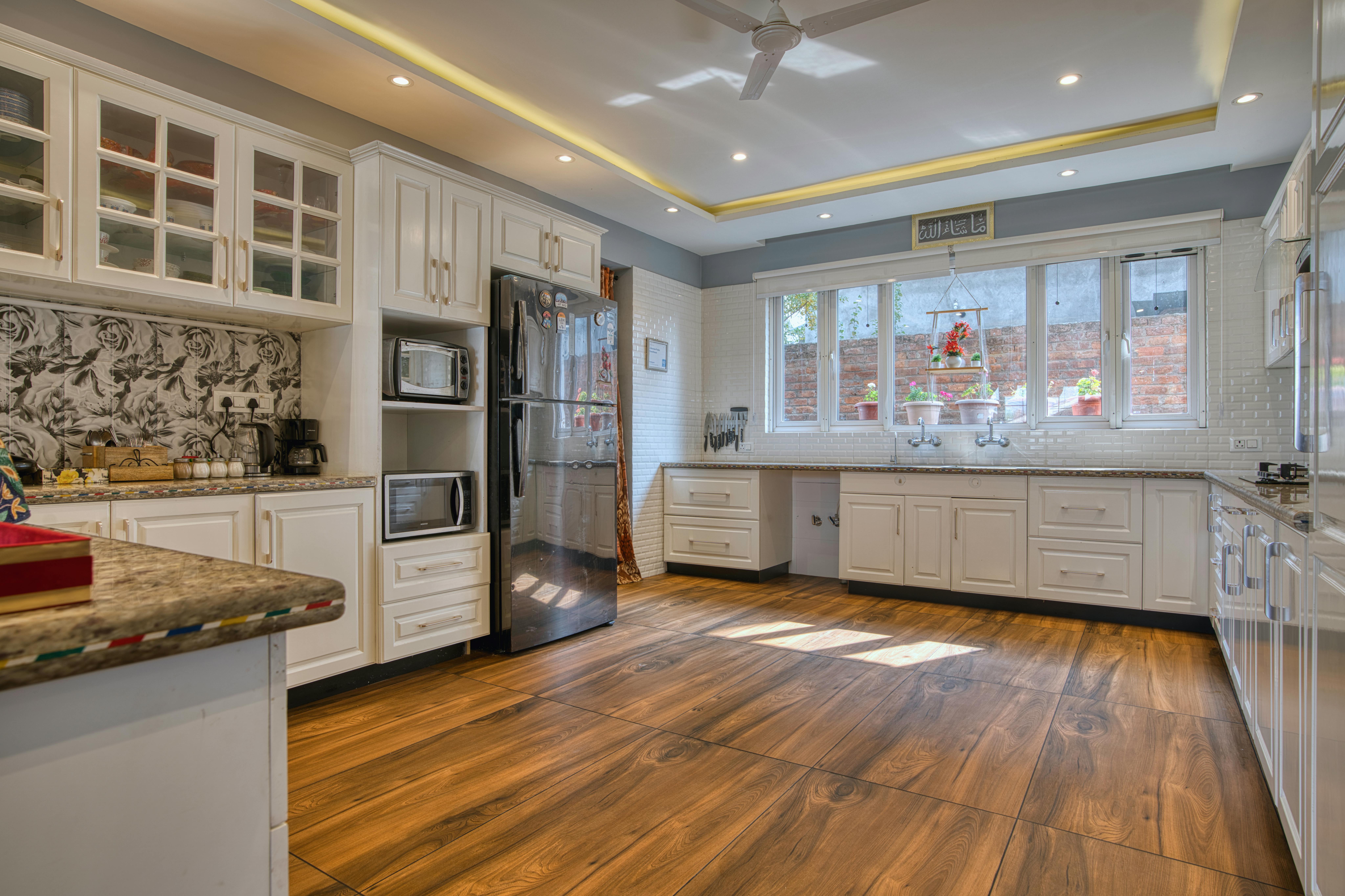 Fancy Modern Kitchen with Big Windows and Hardwood Floor